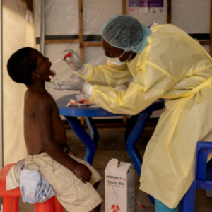 Christian Musema, a laboratory nurse, takes a sample from a child declared a suspected mpox case, at the treatment center in Munigi, Democratic Republic of the Congo, on July 19, 2024. ARLETTE BASHIZI / REUTERS