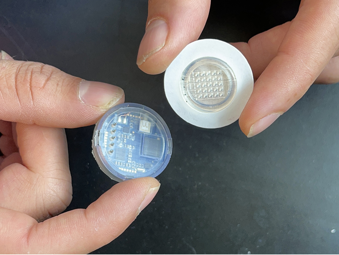 The wearable device combines a disposable patch of microneedles with an electronic device. (Photo credit: Department of NanoEngineering, UC San Diego)